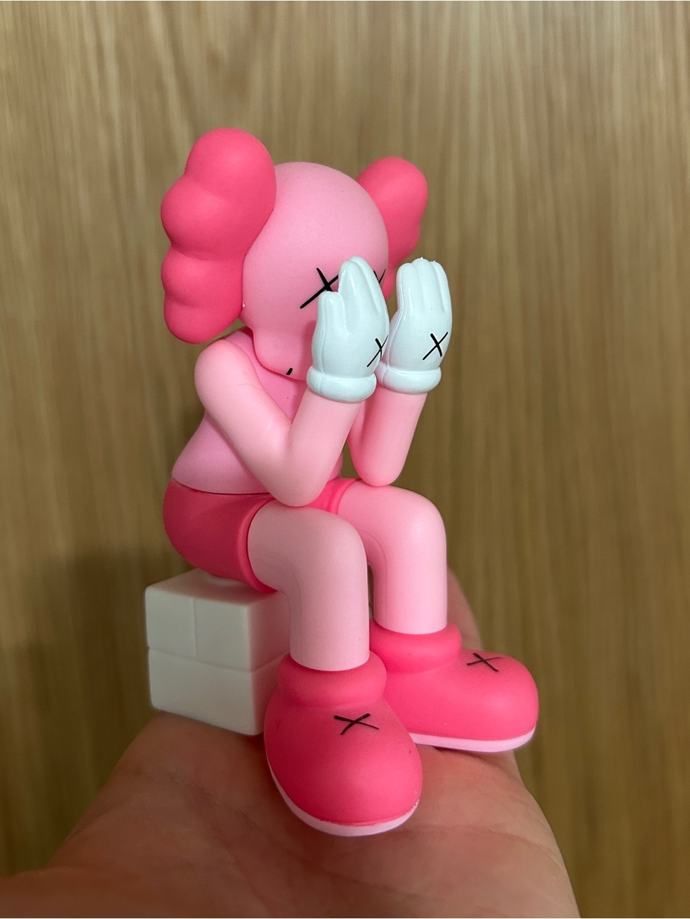 Pink Sitting KAWS-Style Vinyl Figure